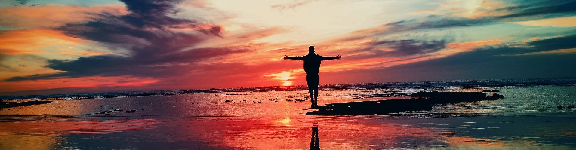 person in silhouette with sunset