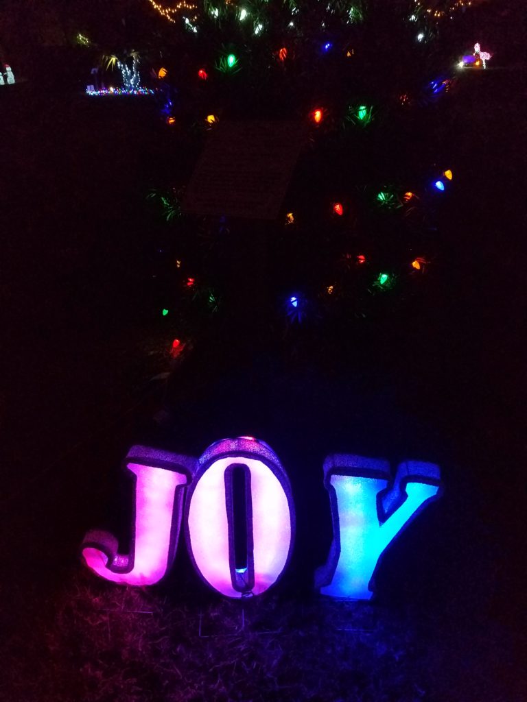 light up word joy with confetti